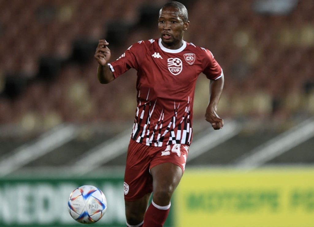 Kamohelo Mokotjo Kaizer Chiefs player about to kick the soccer ball.