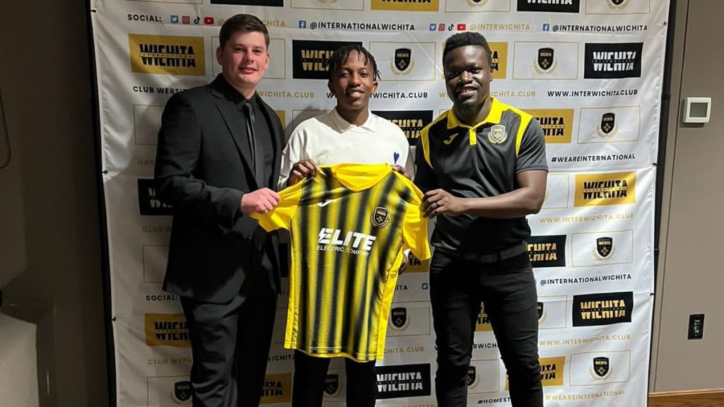 Lusanda Nyathi flanked by Inter Wichita head coach Lewis Derrett [left] and club owner Yves Aka [right]