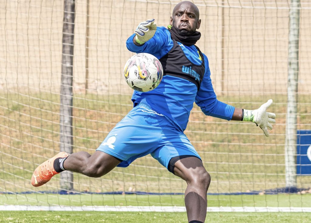 Kennedy Mweene formal Mamelodi Sundowns goal keeper about to kick the ball.