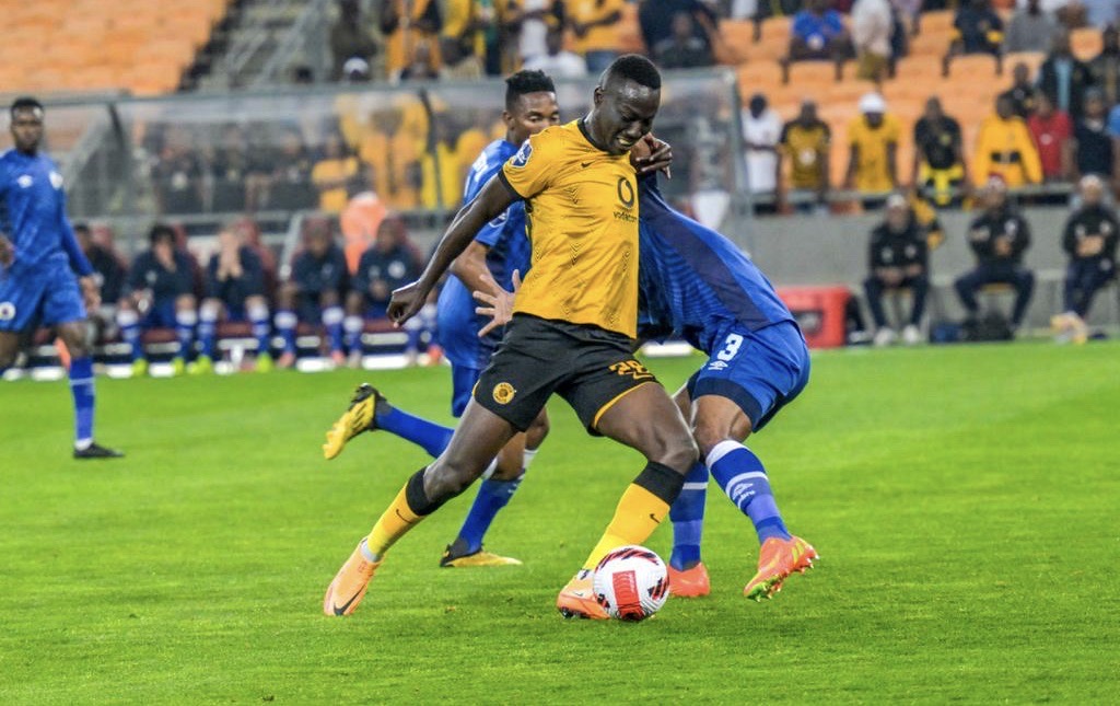 Caleb Bimenyimana Kaizer Chiefs player striking the ball.