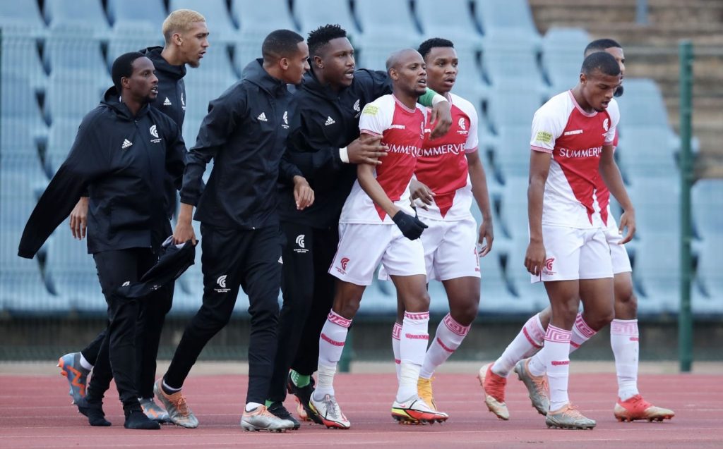 Cape Town Spurs team walking to the field.