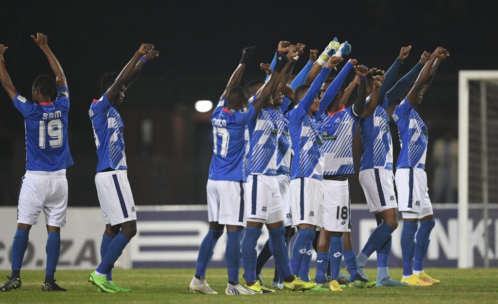 Maritzburg United team cheering at the 2022/23 DStv premiership.