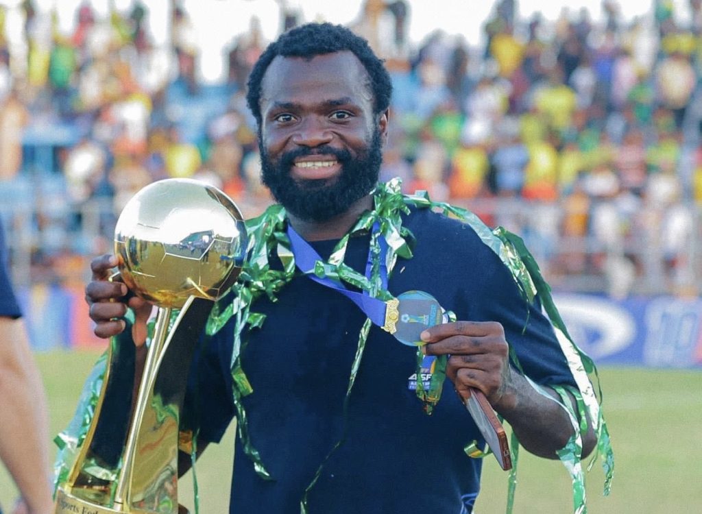 Former Orlando Pirates striker Bernard Morrison holding Trophy.