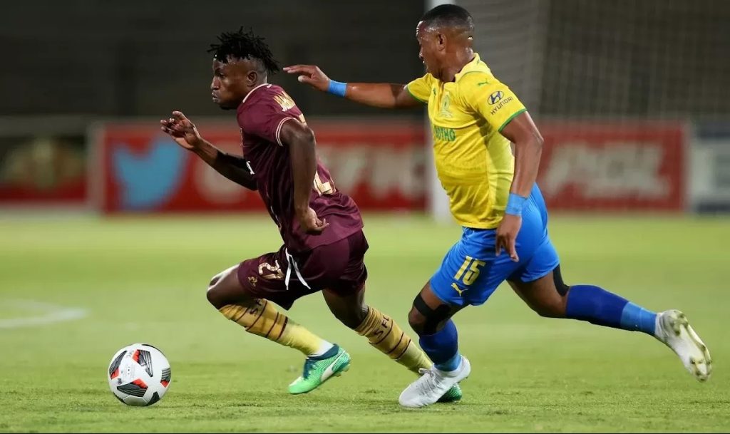 Ibraheem Jabaar Stellenbosch FC attacker striking the ball away from Mamelodi Sundowns player.