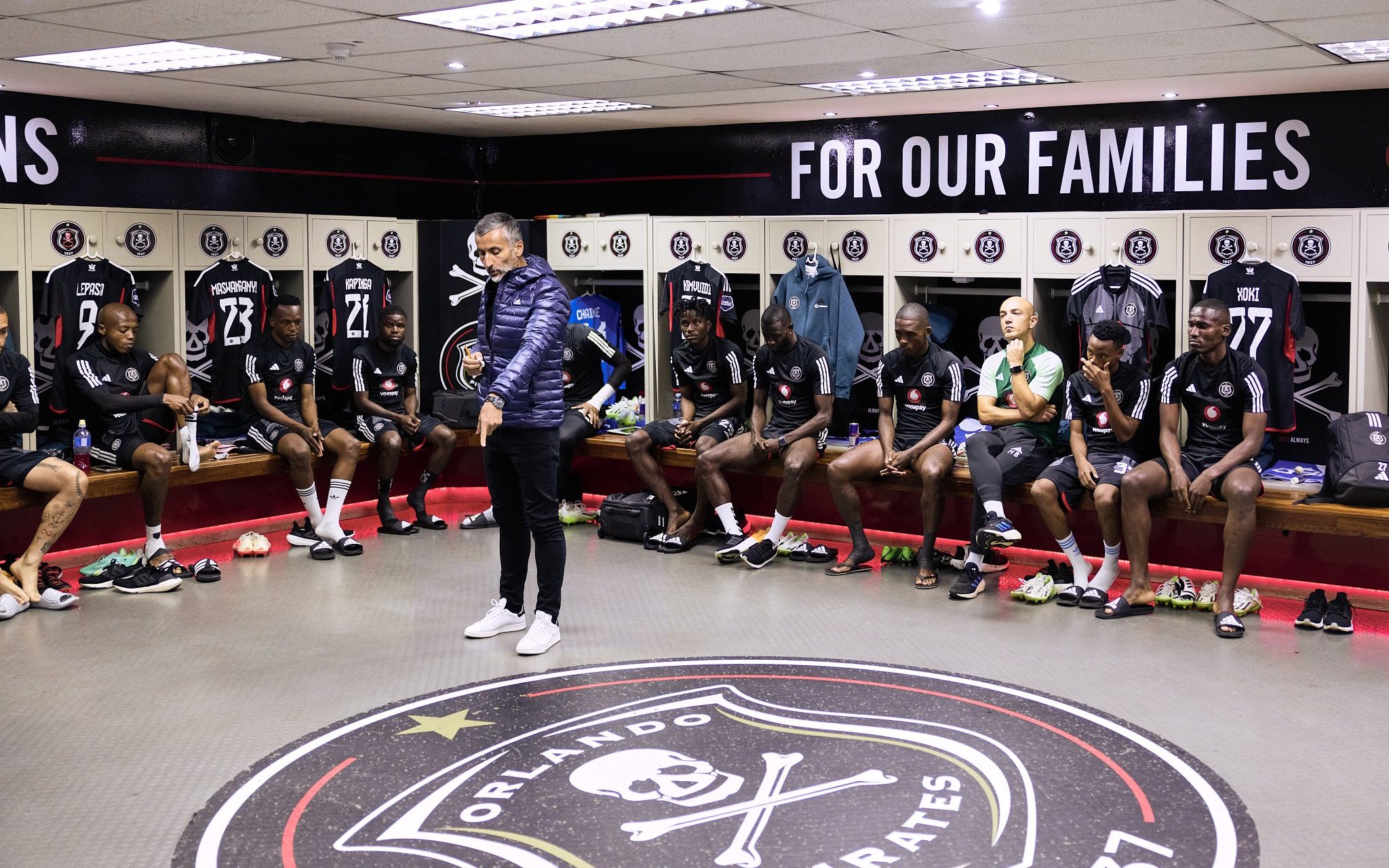 Orlando Pirates players being addressed by head coach Jose Riveiro